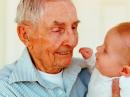 Richard Beckham, W7FVM, with his great-grandchild in 2012. [Courtesy of Carolee Beckham]